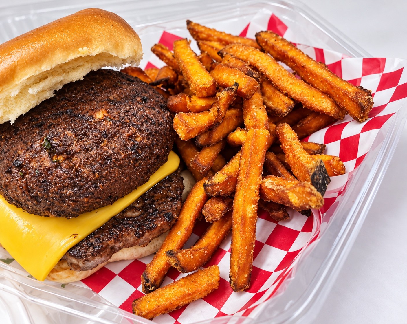 Burger and seasoned fries